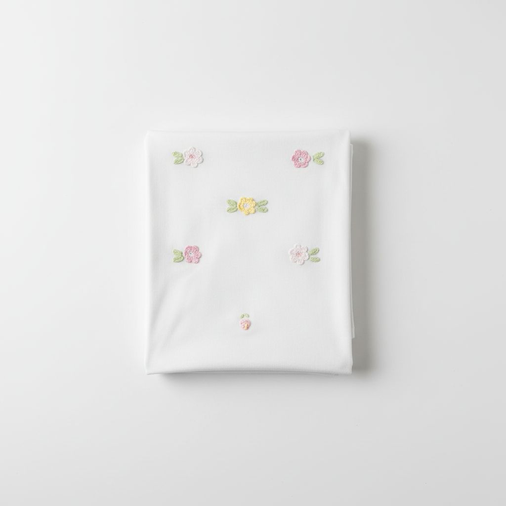 COPERTINA IN JERSEY CON FIORELLINI PRIMODI'