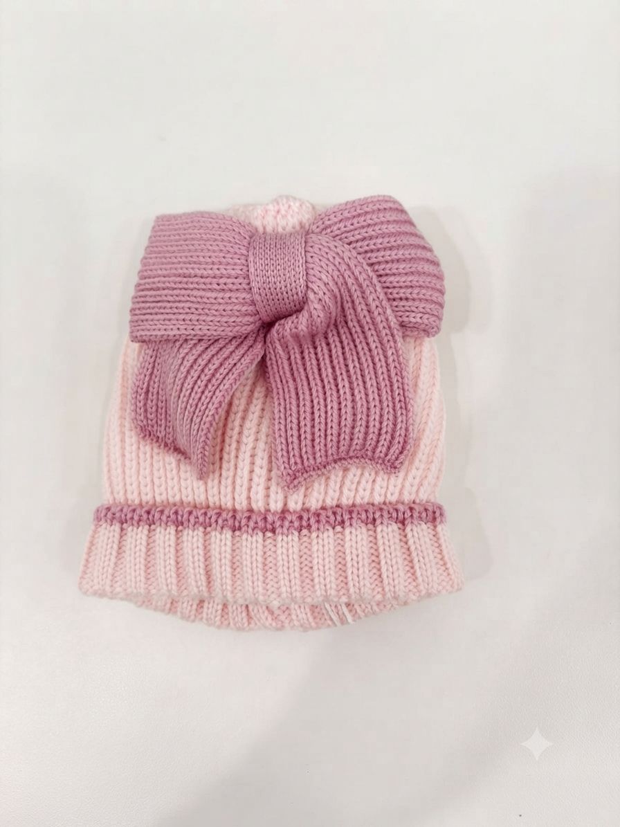 CAPPELLINO IN MAGLIA A COSTE CON FIOCCO BEBE' DI ALMY